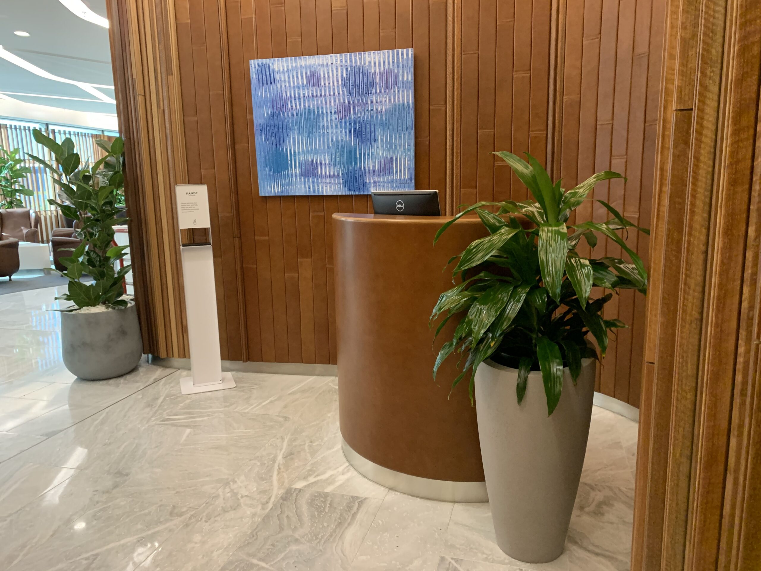 Hotel reception with plants.